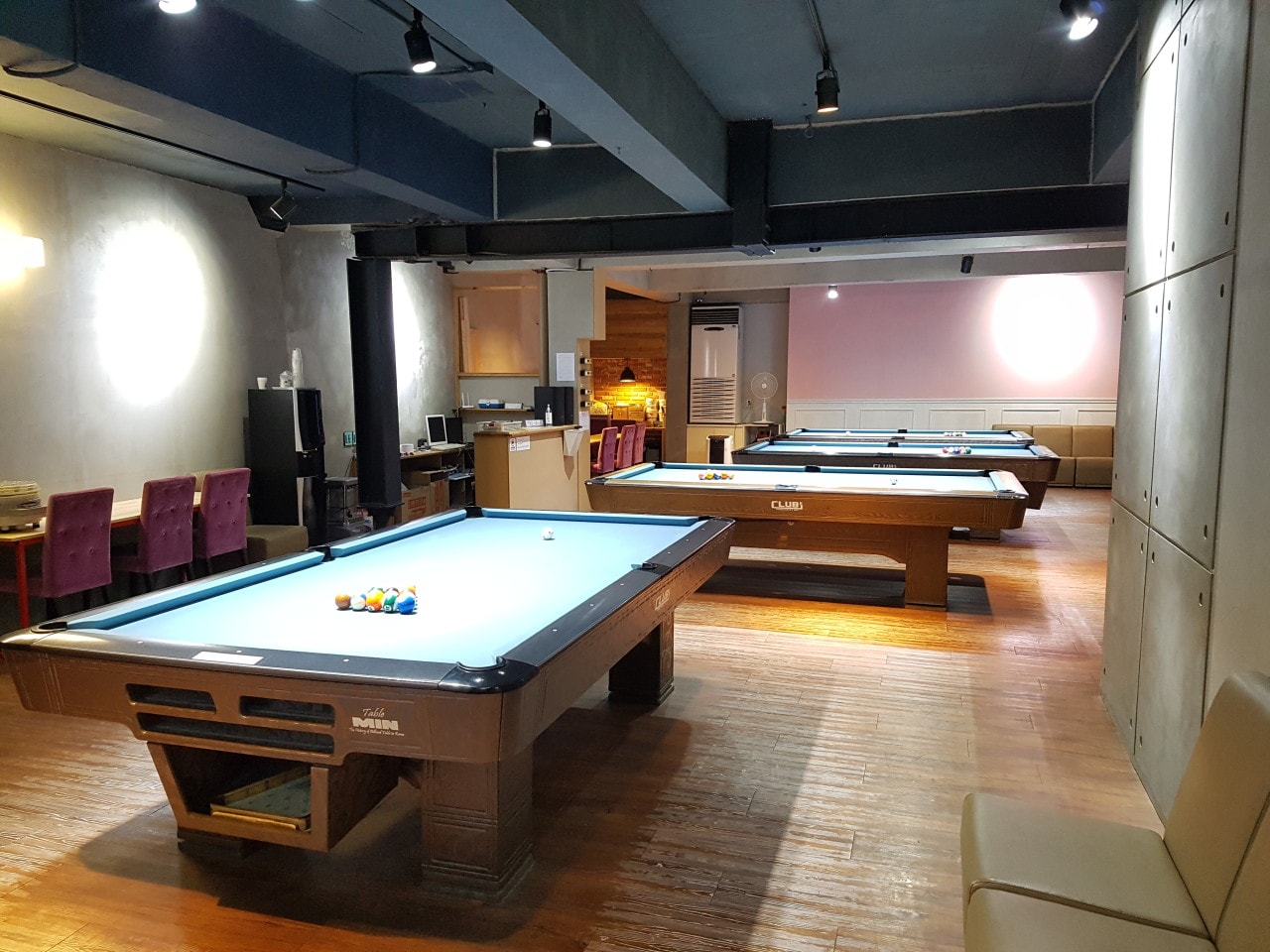 Bustamante interior — pool tables and seating area